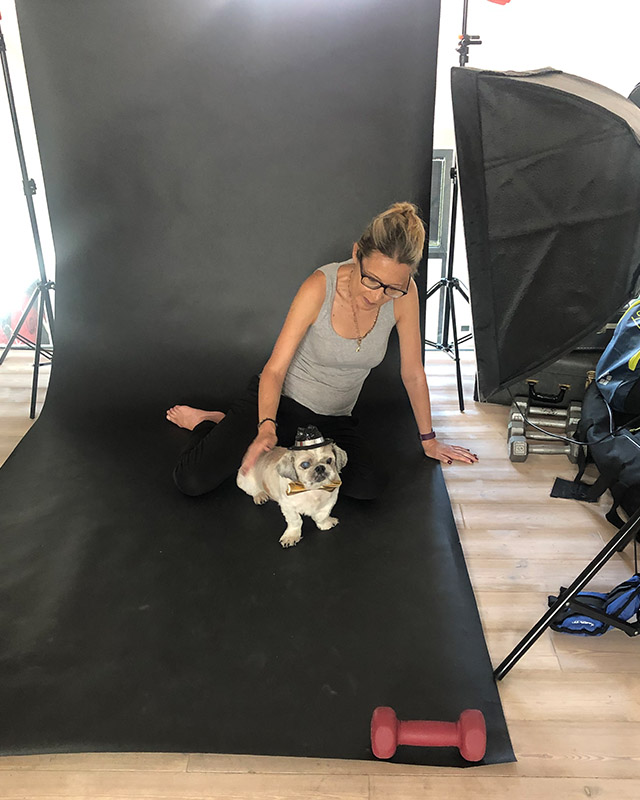 Vinny the partially blind dog, getting used to the studio with a little help from mom.