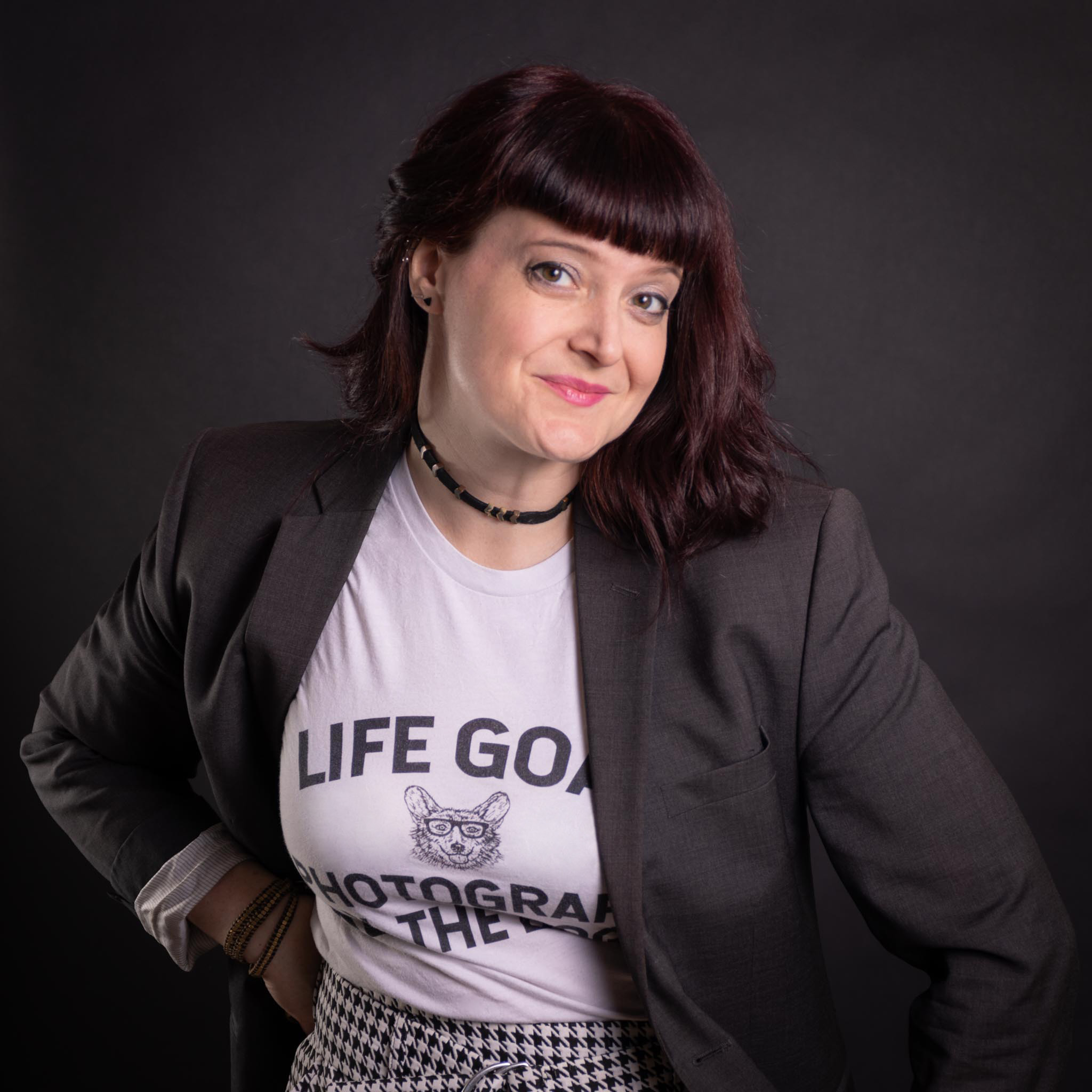 Carol, the super cool photographer, in a blazer and a cool t-shirt about photographing dogs.